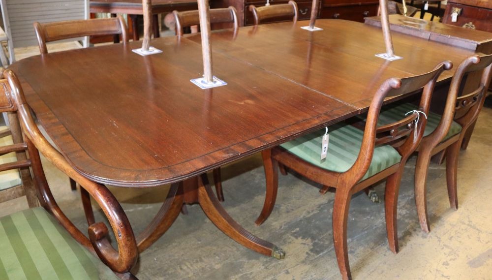 A Regency style mahogany twin pedestal extending dining table, 200cm extended (one spare leaf) W.108cm, H.72cm
